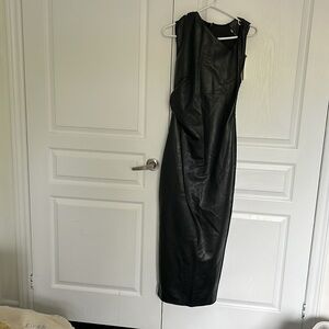 Long black leather dress with a twist on the left shoulder.
